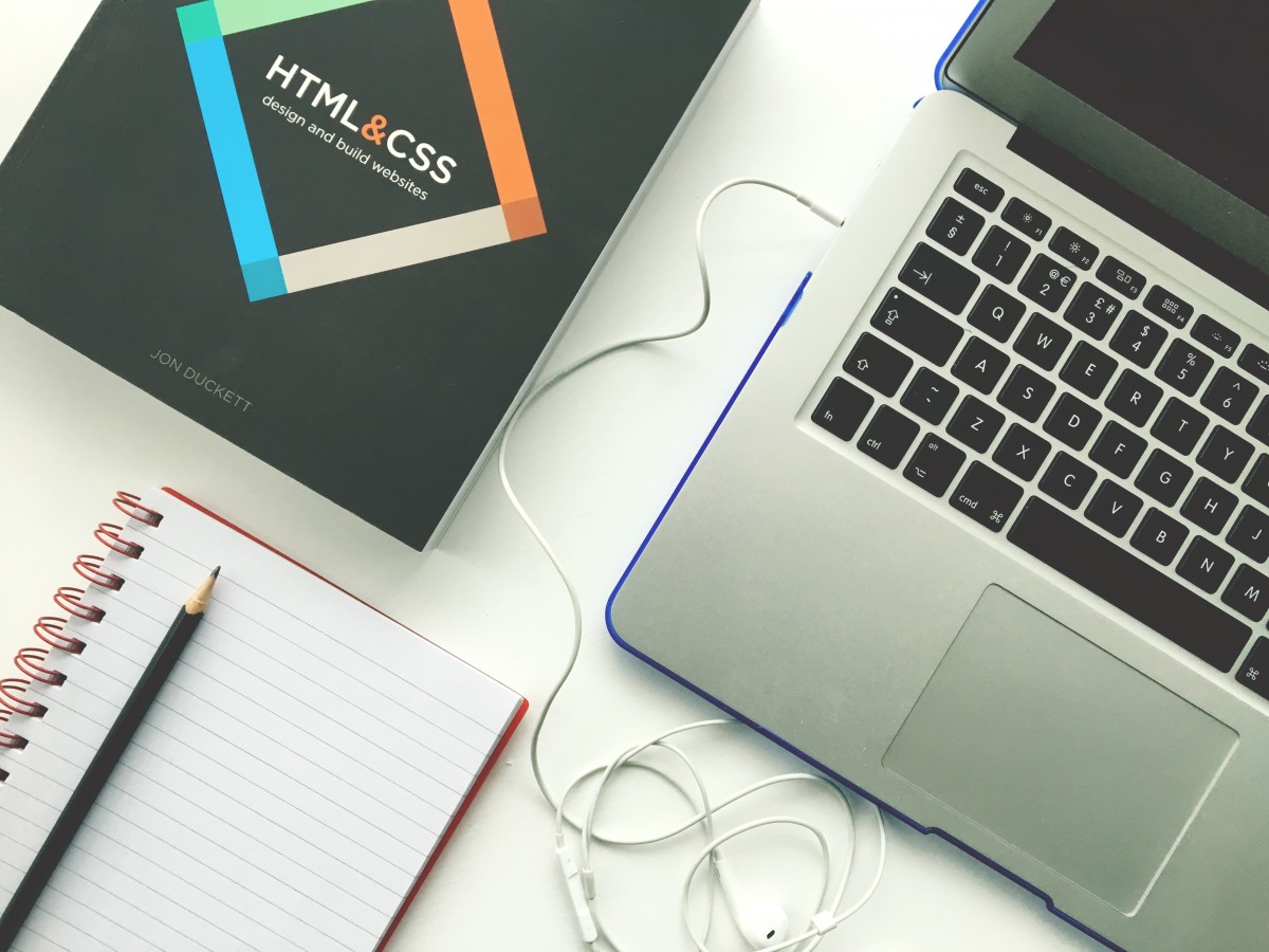 laptop and book on desk